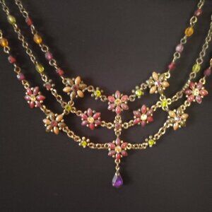 Multi strand floral necklace.